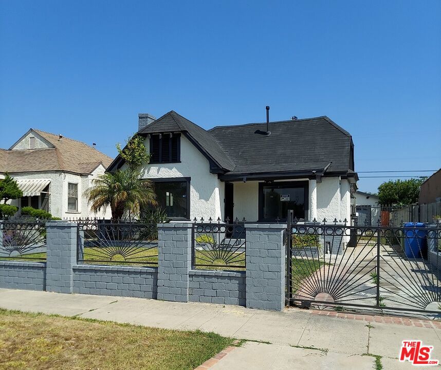 1 Story Traditional totally remodeled home in an ideal location. Property is gated.Charming home filled with natural light.. Large living room with fireplace and new flooring. Large Gourmet kitchen with new cabinetry that opens to a Dining area with bay window overlooking the front yard. Kitchen has room for a washer/dryer. 3 Bedrooms + 2 full remodeled baths and a powder room.Primary Bedroom has a separate office/sitting room with it's owe entrance. Property has a long driveway that leads to a 2 car garage and nice size yard. 2 car detached garage has potential for an ADU. Wonderful location close to freeway access, airport, shopping and the Crenshaw Corridor.