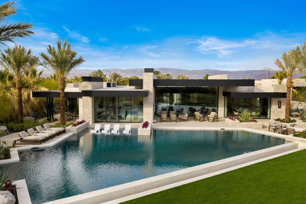Come see for yourself what life is meant to be at The Madison Club. This newly constructed 7,526 sq. ft. 5 bedroom 5 and one half bath contemporary home features spacious living and stunning mountain and golf course views from every room. No detail has been overlooked from the large courtyard with water wall and pond to the private master bath lagoon/spa. Guests will enjoy the 3 bedroom 3 bath casita with large lounge, kitchenette and fireplace. The expansive pocket doors disappear and combine the indoor living and entertaining spaces which include a gourmet kitchen and large welcoming living spaces with outdoor features like the oversized infinity-edge pool with spa and BBQ deck. Situated above the 16th fairway of the acclaimed Tom Fazio designed golf course the panoramic views will take your breath away.