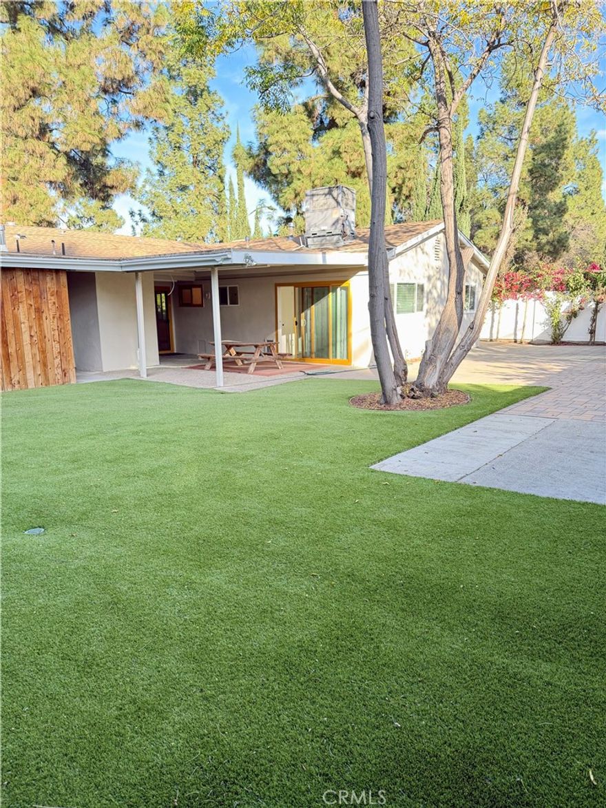 This 3-bedroom, 2-bathroom ranch style home sits on a corner lot in West Hills. The interior has been freshly painted, with new vinyl flooring throughout and smooth ceilings with recessed lighting. Both bathrooms are newly updated, and the home includes a central A/C system.
The living room is spacious and features large windows that bring in natural light. The eat-in kitchen offers tile backsplash, quartz countertops, and a stainless-steel oven and dishwasher. Multiple sliding doors lead to the backyard.
The primary bedroom includes an attached bathroom with new shower. A separate laundry room is located just off the kitchen. 
The front and back yards feature low-maintenance professional landscaping and hardscaping, with a covered patio area suitable for outdoor dining. Parking includes space for up to four cars in the driveway, along with ample street parking. The garage is not accessible, as it has been converted to an ADU. Two storage sheds and a storage closet are available for use. Main plumbing and sewer has also been replaced. 
Conveniently located near West Hills Hospital, Fallbrook Center, and Warner Center. Owner requires good credit, verification of income, and a complete rental history. Gas is included in rent. Available for immediate move-in!