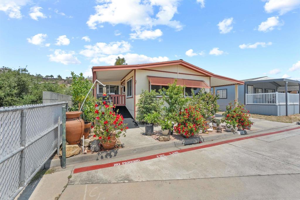 Welcome to Twin Oaks Valley Park, a highly desirable land-owned, all-age community in the heart of San Marcos! This charming 2-bedroom, 2-bath manufactured home offers comfortable living with the bonus of a spacious sunroom—perfect as a home office, hobby space, or relaxation area. Situated on a premium corner lot, you’ll enjoy added privacy with only one neighbor next door. Inside, the open layout provides a bright and airy feel, while outside you’ll find a low-maintenance yard and carport parking. Twin Oaks Valley Park offers a prime location just minutes from Cal State San Marcos, Palomar College, Kaiser and Palomar Hospitals, the Sprinter station, shopping, dining, and easy access to Hwy 78 for quick commuting across North County. Don't miss your chance to own in this welcoming community where you own the land—no space rent!