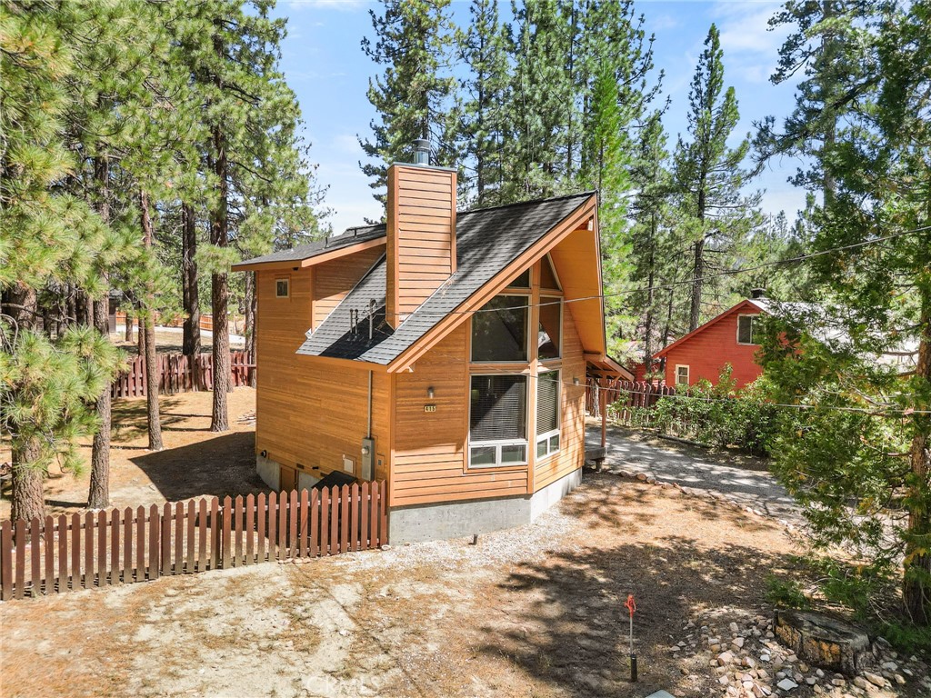 Welcome to 415 Piney Ln Big Bear Lake, a Charming A-frame cabin nestled on a quiet cul-de-sac in Big Bear Lake. Built in 2008, this 2-bedroom, 2-bath retreat features 1,266 sq ft of cozy living space with soaring ceilings, a dramatic wall of windows, and warm wood finishes. Set on a spacious 7,566 sq ft lot surrounded by pines, it’s just minutes from the lake, ski resorts, and the village. Ideal as a full-time home, vacation getaway, or short-term rental investment with strong income potential.