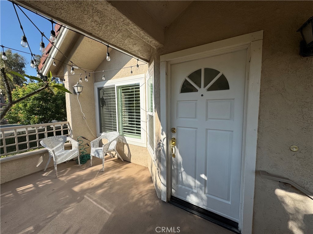 WELCOME HOME TO THIS LOVELY WOOD RANCH HOME, 2 BEDROOM 2 BATH END UNIT, LOCATED ON THE UPPER LEVEL (A GARAGE IS BELOW THE UNIT). THIS CHARMING HOME FEATURES NEW LUXURY VINYL FLOORING, NEWER UPGRADED DOUBLE-PANE MILGARD WINDOWS, AND SHUTTERS THROUGHOUT. THE OPEN LAYOUT OFFERS A SPACIOUS LIVING AREA FILLED WITH TONS OF NATURAL LIGHT, AND AN UPGRADED FIREPLACE, BOTH GAS AND WOOD BURNING, AND FLOWS SEAMLESSLY INTO THE DINING ROOM AND UPGRADED KITCHEN WITH QUARTZ COUNTERTOPS AND BACKSPLASH, FILTERED COLD WATER, AND SOFT-CLOSE CABINETS WITH MODERN HARDWARE. ENJOY TWO GOOD SIZED BEDROOMS AND TWO FULL BATHS, INCLUDING A LARGE WALK-IN CLOSET IN THE PRIMARY BEDROOM. ADDITIONAL HIGHLIGHTS INCLUDE A NEW WI-FI THERMOSTAT, NEWER WATER HEATER AND FURNACE, NEWER WASHER AND DRYER, REFRIGERATOR, AND A NATURAL GAS HOOKUP ON THE PATIO. THIS HOME INCLUDES A DETACHED ONE-CAR GARAGE AND ACCESS TO A BEAUTIFULLY UPGRADED COMMUNITY POOL COMPLETE WITH NEW OUTDOOR FURNITURE. COZY, PRIVATE, AND MOVE-IN READY.