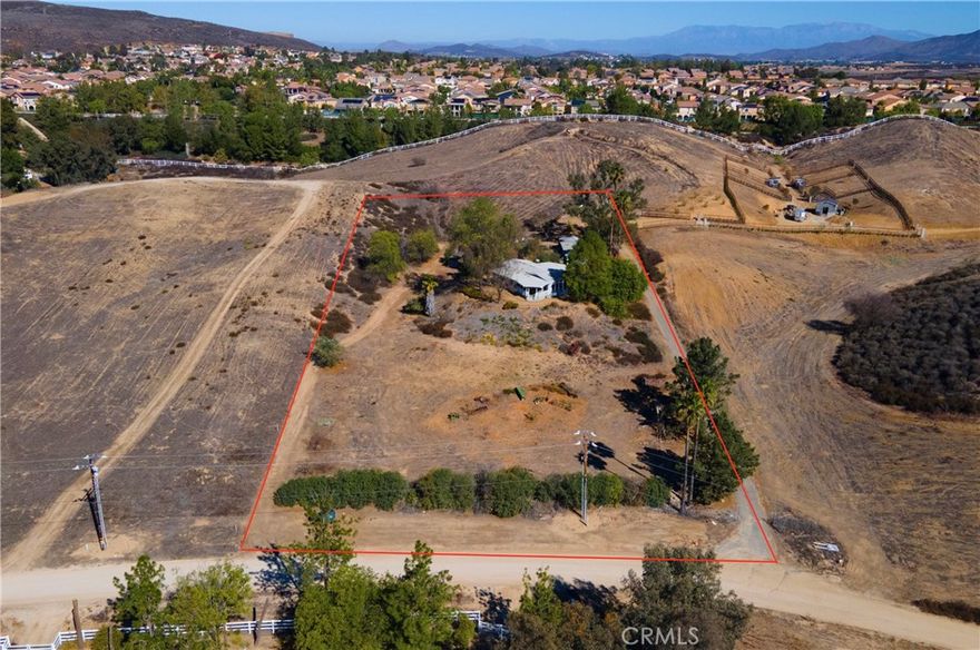 Ranch Living in the Heart of Temecula! Discover the perfect blend of country charm and city convenience with this 3-bedroom, 2-bath ranch home set on 2.5 usable acres. Enjoy panoramic views and peaceful privacy while being within walking distance to parks, shopping, and dining—an unbeatable location!

The property features an oversized detached garage and workshop, ideal for hobbyists, car enthusiasts, or anyone needing extra space to create. The 3rd bedroom features a small closet and separate room with a sink. Great for office or additional workshop. There’s plenty of room for horses, chickens, goats, or a lush garden, and endless potential to add an ADU or expand into your own family compound.

Nestled within the award-winning Temecula Unified School District, this property offers both opportunity and lifestyle. With a little vision, this diamond in the rough can truly shine—don’t miss your chance to make it your own piece of Temecula paradise!