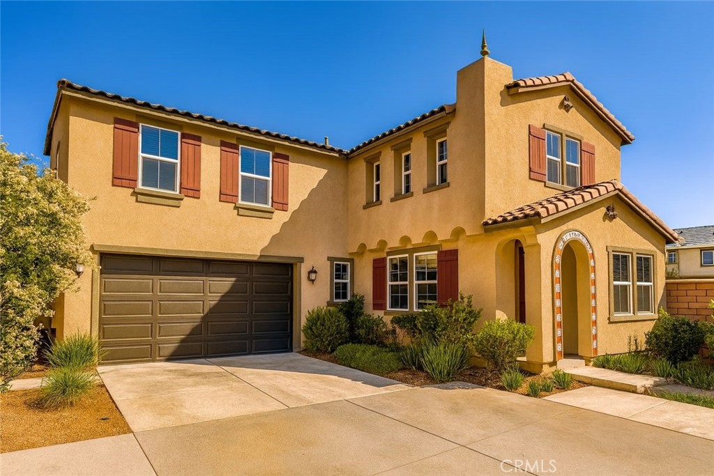 Stop searching and start earning with this beautifully maintained 5-bedroom, 3-bathroom home in Ontario Ranch, priced below nearby comps. Featuring a bright great room with built-in media shelves, modern fireplace, and abundant natural light, the open floor plan flows into a gourmet kitchen with quartz countertops, shaker cabinets, stainless-steel appliances, island, and breakfast bar. A bedroom and full bath downstairs provide flexibility, while the upstairs offers a spacious loft, perfect for entertainment or a home office. The primary suite includes a walk-in closet, dual vanities, soaking tub, and separate shower. Energy-efficient paid-off solar panels, a laundry room with utility sink, and a landscaped backyard with artificial turf add comfort and convenience. Across the street, enjoy playgrounds and picnic areas, with major shopping, dining, and freeway access minutes away. Whether for investment or personal living, this property delivers immediate rental income and long-term appreciation potential.