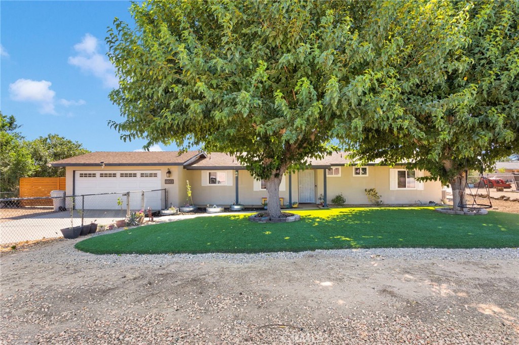 Welcome to this beautifully upgraded 3-bedroom, 2-bath home—plus a versatile optional 4th bedroom, perfect for a home office, guest space, or craft room. Located in the heart of Hesperia, this property sits on nearly half an acre and offers RV access, a new 10x12 storage shed on a gravel base, and easy access to I-15, schools, shopping, and medical facilities.
Step inside to discover stunning porcelain wood-look flooring throughout the main living areas, accented by recessed lighting and designer touches. The adjacent flex room features a striking accent wall, sliding glass door to the backyard, and endless possibilities for use.
The fully remodeled kitchen is a true showstopper, featuring quartz countertops, a marble backsplash, new cabinetry, a farmhouse sink, a breakfast bar with pendant lighting, recessed lights, and a built-in coffee bar—perfect for morning routines and entertaining. Just off the kitchen is a dedicated dining area featuring a ceiling fan.
Both bathrooms have been stylishly updated. The guest bath boasts a new vanity, framed mirror, decorative batten wall, and a shower/tub combo. The primary suite includes a custom accent wall, ceiling fan, and an en suite bathroom with a beautifully tiled walk-in shower with mosaic accents.
Outdoor upgrades include a brand-new 1,200 sq. ft. artificial turf front lawn and mature trees offering cooling shade. Enjoy the Alumawood-covered patio with integrated LED lighting and a concrete slab—ideal for outdoor dining or relaxation.
Additional improvements provide peace of mind:
Brand new central A/C system with all-new ducting and an iWave air purifier system,
Newly installed water heater,
New roofing on the rear portion of the home,and newer double pane windows.
This energy-efficient, move-in ready gem combines modern comfort with outdoor space and convenience. Don’t miss this opportunity to own a beautifully updated home with room to grow!