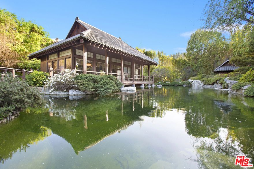 Fully furnished and turn-key. This property is available for short and long-term rental! Immerse yourself in luxury, opulence, and history in this fully furnished, turnkey Tudor revival mansion spanning multiple structures on over 3+ acres.  Drive through the gate and up the shaded private driveway to the dramatic motor court perched in front of the 9,700 square foot main house with high pitched roof, leaded glass mullion windows and imposing archways. Inside you will be treated to the grand scale of upper floor master suite and 2 guest rooms. The main floor features 2 guest rooms, gourmet kitchen, formal dining room, theater and salon. Relax on the lush grounds which include a sundeck and pool with 2 guest room pool house, a dual purpose tennis and basketball court, a guest house and detached office. Transport yourself to the unique quiet of an authentic Japanese tea house with guest quarters perched on a koi pond in the attached parcel. Fully furnished and located in the Holmby Hills, this gorgeous 10 bedroom compound is available for long or short term rental. Additionally, it will serve you exquisitely whether as your private residence or for a corporate function, intimate private party, wedding destination, or filming location.