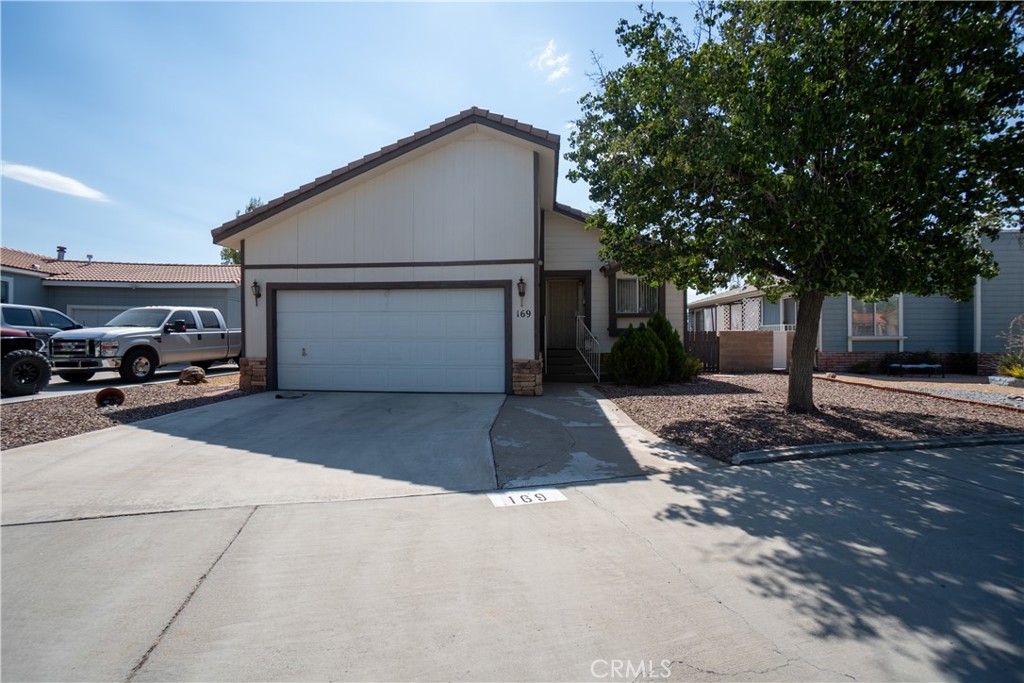 GORGEOUS Prefeb Delaware Manufactured Home that looks and feels like a standard stick build regular home!! Located in Apple Valley in a exclusive 55+ Gated Community of Vista Del Rosa. 3 spacious bedrooms, 2 full bathrooms, about 1500 sqft of living spaces with 2 cars attached garage. High cathedral ceiling, window blinds, drapes, fan and light fixtures throughout the home. Open living room with gorgeous fireplace. The kitchen has all appliances with plenty of cabinetry. The dining area next to the kitchen for convenience. In house indoor laundry. Residents of Vista Del Rosa enjoy access to many fantastic facilities, including a clubhouse, a refreshing pool area, tennis courts, RV storage, a dog park, plenty of BBQ areas, and a tranquil pond with water features. Plus, the community is thoughtfully gated for added privacy and security. Don't miss the opportunity to make this vibrant community your new home