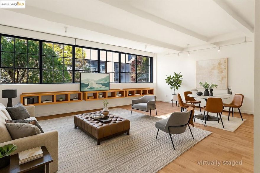 SELLER IS OFFERING A $12,924 CREDIT TOWARD HOA FEES, COVERING ONE FULL YEAR! Discover refined urban living in this beautifully updated live/work loft style condo located at the Oliver Lofts in the heart of Emeryville. Sophisticated & modern, this spacious loft showcases an open floor plan w/ high ceilings, freshly painted interiors, & refinished hardwood floors that highlight its industrial character. The kitchen has been thoughtfully updated w/ a new GE electric glass-top range & oven, sleek chrome pull-down sprayer faucet, & connected ice maker. The large office space can serve as a 2nd bedroom, den, or exercise room. Upstairs features a full bath, spacious bedroom & in-unit laundry. The newly remodeled bathroom boasts a new Castico composite stone shower w/ frameless Coraline XL sliding door, an elegant Allen+Roth marble-top vanity, & an LED fog-free medicine cabinet. The bedroom offers plush comfort w/ premium short-pile carpet & top-quality padding & Bali Blinds. Additional upgrades include a new return air grill w/ easy-access filter, new GE washer and dryer, & stylish finishes throughout. Perfectly positioned near shopping, dining, & major commuter routes, this modern Emeryville loft blends industrial charm w/ contemporary elegance - ideal for today’s creative lifestyle.