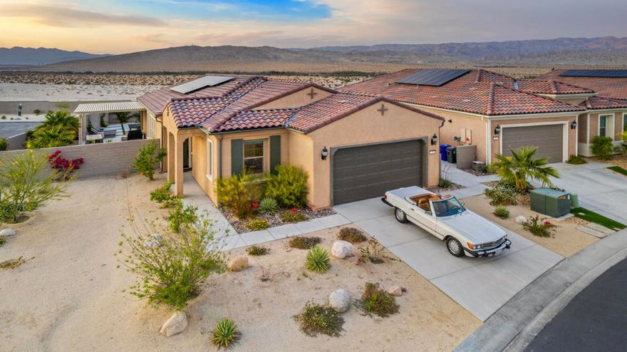 Welcome to 10 Zinfandel in the prestigious Del Webb, Rancho Mirage 55+ community. This stunning, Expedition Model, single-family home boasting 1,770 square feet of well-designed living space offers a harmonious blend of comfort and style. As you step inside, you'll be greeted by high ceilings and gleaming hardwood floors that flow seamlessly throughout the home. The spacious living area is anchored by the working fireplace, creating a cozy ambiance for relaxation.The chef's kitchen is a culinary dream, featuring a breakfast bar, gas stove, an island with premium quartz counters, range hood, refrigerator, wall oven and built-in microwave. This open kitchen is designed for both everyday cooking and entertaining.The home offers three generous bedrooms, including a primary suite with an ensuite bathroom. The primary bathroom features separate vanities and a windowed design, providing a bright and airy feel.Step outside to your upgraded pool and spa, with a custom pergola perfect for outdoor dining and relaxation. The private backyard with stunning desert views includes a barbecue area, ideal for gatherings. Parking is a breeze with an attached garage, guest parking, and street parking available.Residents of this community enjoy access to exceptional amenities, including a clubhouse, common media/recreation room (for yoga classes and community events etc), two large communal pools, a jacuzzi, pickle ball and tennis courts, 18-hole putting green, golf simulator and a state-of-the-art gym. With central AC, central heating, and 13 owned solar panels this home ensures year-round comfort. Experience the best of indoor and outdoor living at Del Webb, Rancho Mirage. Don't miss this opportunity to make it yours!