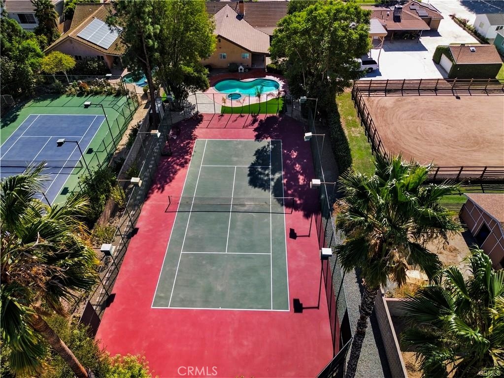 HUGE PROFESSIONAL TENNIS COURT HOUSE.
If you want to live in Paradise Oasis, that is the place for you.
TURN IN KEYS. This expansive 0.6-acre gated estate has been meticulously REMODELED to glamour with modern elegance. A Grand Foyer with warm tones, Natural light, creates an inviting and sophisticated atmosphere that welcomes everyone. The living room has a fireplace that sets the stage for elegant entertaining, and Dancing Place with a Bar Counter adds timeless charm. Multiple gathering spaces, including a Dining room overlooking the manicured grounds, flow seamlessly throughout. Cozy family room that opens to an outdoor dining area shaded by mature grapevines. A house with spacious bedrooms has its own bathroom and walk-in closet. The Master Bedroom has two walk-in closets. There is a Sauna and a Jacuzzi in the Master bathroom. An open floor plan perfect for entertaining, this property showcases high-end finishes and custom details. Also has Secret Safe. The gourmet chef's kitchen (completely renovated)boasts steel appliances, while the master suite offers a serene retreat. Upon entering, you'll be greeted by an airy layout with a dual fireplace, high ceilings, and sliding doors that open to the backyard, inviting a refreshing breeze. Outside, the landscaped grounds feature a sparkling. pool and cozy seating areas. Professional Tennis court completely refaced with new paint, with a bike path and a Basketball court ideal for sports activities. Mounting View with a fresh area. Three-car garage with a single new door opener and RV gate, and also an additional 6 parking spaces. The house is fresh with new stucco and paint outside. Redesigned the yard. New Tile is on the Patio. New is on the yard. Garden with different fruits: Plums, Orange, Tangerines, Lemon, Cherry, Apple, Grapefruit. All property Fences. You will have complete Security and Privacy. HORSE PROPERTY. No HOA. Also, this house is registered for a film. Located just 10 minutes from world-class dining, Shopping, and Entertainment, this Topanga Canyon residence truly embodies luxury living. Offering a seamless blend of luxurious living and resort-style amenities, this estate provides an unparalleled opportunity to experience the epitome of refined elegance in one of Los Angeles's most coveted locations.