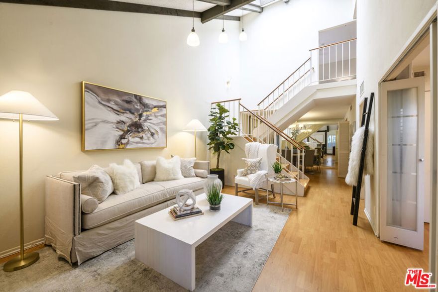 Come to see this recently refreshed townhome with the rare lake views that you have been waiting for. Seller has moved on and the unit is ready to go and priced to sell. It has 3 bedrooms, 2 baths, 1 bedroom  is downstairs being used as an office, and has an attached bath. There are 3 outdoor patios for al fresco dining. Enjoy the outdoor lake views while you dine. The kitchen has been updated and includes in unit washer and dryer and a large pantry. There is new heating and air conditioning. There is 2 car side by side parking with storage units. New roof just installed! Shopping and restaurants are right across the street at Raintree Plaza! This unit is also located near the Clubhouse and pool, also featuring lake views. The Clubhouse features a kitchen, library area, hardwood floors and plenty of room for entertaining. Downstairs features saunas, a gym and a pool table. Lakeside Villas has gated access with 24 hour access personnel.  It is 2 dog friendly with park-like grounds and activities so you can get to know your neighbors. Has on site Management. This property with its park-like grounds was once part of the MGM movie lot.
