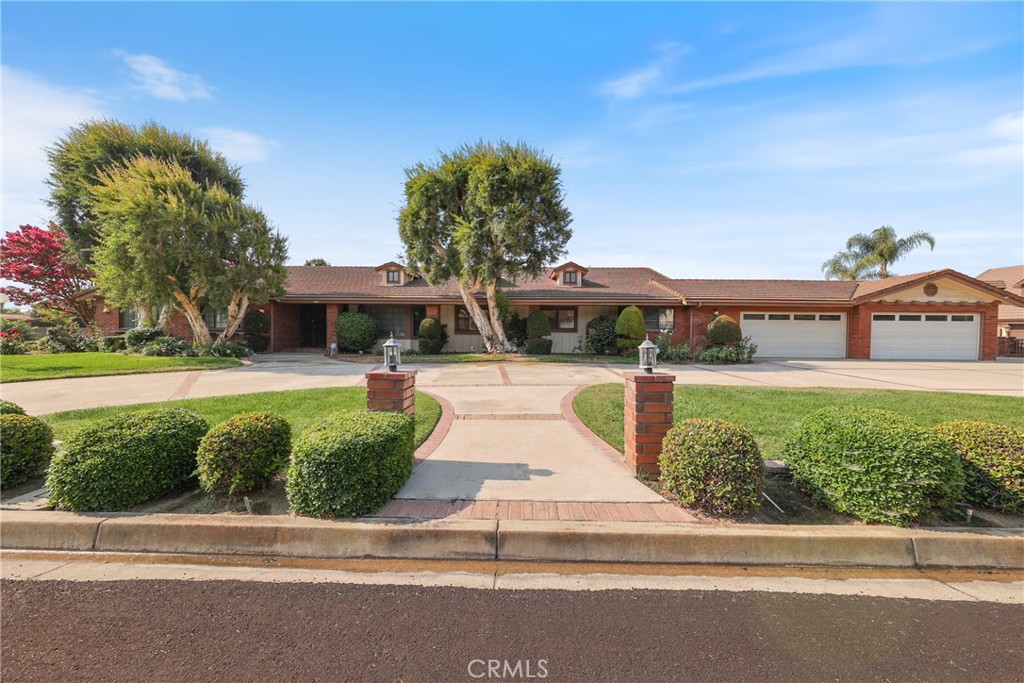 This custom built home is located in a great area of beautiful with 1 acre+, Gorgeous step down living room with decorative open ceiling with lots of space with view of pool area, huge family room with Gorgeous decorative fireplace with lots of light & view of pool area also including attached large wet bar area & game room, All bedrooms are large including oversized master with beautiful round fireplace, large roman tub, dressing area & huge walk in closer plus additional closet, 2 oversized dining's areas including formal dining room with plenty of room for guests, Kitchen area with lots of room Inc. breakfast counter with large window & light of light, laundry room with lots of room for storage, spacious pantry area, Extra large fenced pool area & jacuzzi with plenty of room for entertaining with big covered patio area with ceiling fans, exterior Inc. lots of extra amenities with attached 4 car garage with double doors plus an additional deep detached Tandem 7 car garage with 7 roll up doors to park your extra vehicles or recreational toys maybe able to park 14+ cars, Lots of room with extra parking for your R.V'S slab area at backyard area. Great curb appeal on this ranch style home.