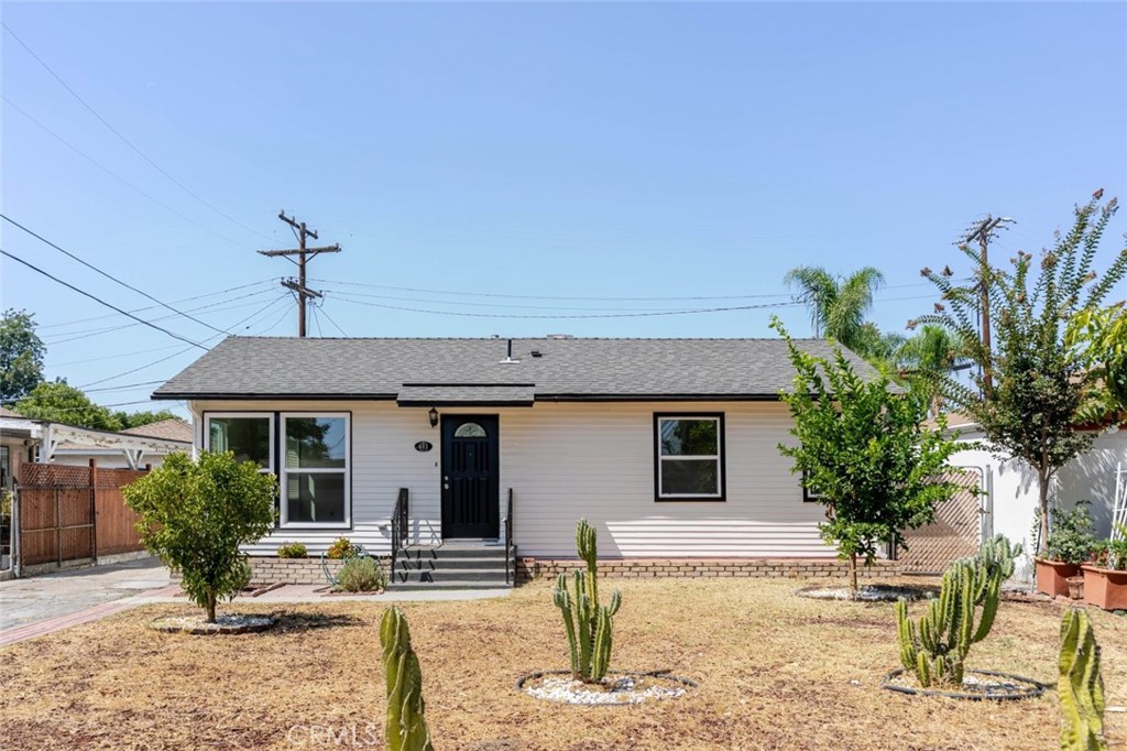 Welcome to this beautifully updated 2 bedroom 2 bathroom, single-family residence offering comfort, style, and convenience. Situated on a spacious 5,163 sq ft lot, this 1,161 sq ft home features thoughtfully designed living spaces and modern upgrades throughout. Inside you'll discover sleek vinyl wood-style flooring, recessed lighting, and a bright, open layout perfect for both relaxing and entertaining. The updated kitchen boasts a center island with a built-in cooktop, providing a stylish and functional space for cooking and gathering. The bathroom has been tastefully remodeled with elegant tilework in the shower, creating a spa-like experience. Additional highlights include washer and dryer hookups and a covered patio, ideal for outdoor dining or enjoying the California sunshine year-round. Additionally, the property includes a well appointed 2 bedroom, 1 bathroom ADU, offering a versatile living space ideal for extended family, guests, or potential rental income. Located minutes from DreamWorks campus. Welcome Home!