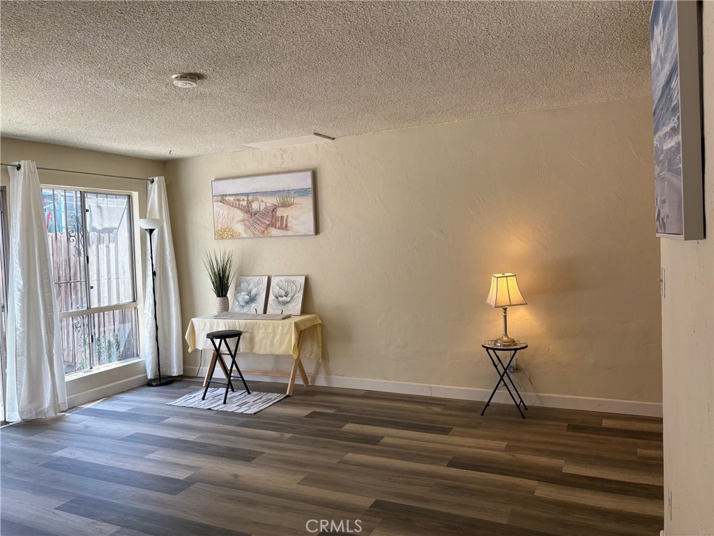 Recently refreshed townhome-style unit with 2 bedrooms, 1.5 baths available now that has approximately 1100 square feet of comfortable living space. Conveniently located in the fantastic coastline neighborhood of Redondo Beach. Easy access to popular destinations to enjoy dining, shopping and recreational activities. The living room has a built-in faux wood-log electric fireplace. The rear patio yard is newly landscaped. This unit is freshly painted and includes many new features like the upgraded flooring throughout with luxury vinyl planks in kitchen, dining, living room and bathrooms. Includes new ceiling fan fixture over dining room, new lighting fixtures in kitchen, powder room and stairwell areas. An approximately 225 square-feet roof deck has a 360-degree city view. Two car parking with one enclosed garage and another adjacent in the exterior covered-space. This unit also features the all new range/oven and cook-vent, dishwasher, and plumbing fixtures.