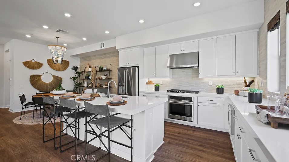 The first level of this three-story townhome is host to a bedroom that’s perfect for overnight guests or a home office. The Great Room, kitchen and dining room are arranged among an open floorplan on the second level that makes multitasking and entertaining a breeze. A deck complements the open living space. Three more bedrooms can be found on the top floor. Crest is a collection of new luxury townhomes at the Metro Heights masterplan in Montebello, CA. Onsite amenities include a resort-style clubhouse, pool, spa and much more. Located within walking distance of The Shops at Montebello and Montebello Town Square, residents also enjoy proximity to the CA-60 freeway for easy access to downtown Los Angeles for more shopping, dining and entertainment options.