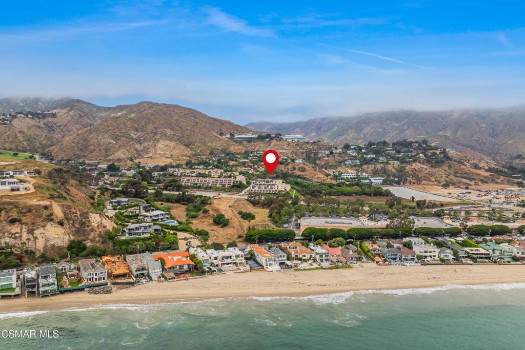 Discover your serene retreat in Malibu Canyon Village--a beautifully updated, private second-level condo just moments from the beach. This spacious 2-bedroom, 2-bath unit features brand-new stainless steel appliances and stylish finishes throughout. The open kitchen with brand new appliances flows to a living area and private balcony overlooking lush, landscaped grounds, perfect for unwinding. Both bedrooms offer large closets and ample space, ideal for a Pepperdine student seeking relaxation after a long day. Nestled in a guard-gated complex with 24/7 on-site security, this property affords each resident resort-style amenities including a tennis court, fitness center, pool, spa, and communal areas that offer peaceful Pacific Ocean vistas. Two designated covered parking spaces provide added convenience. Set in a quiet, verdant enclave of Malibu, this condo seamlessly blends coastal charm, contemporary comfort, and university proximity--an ideal home for those who value serenity and style.