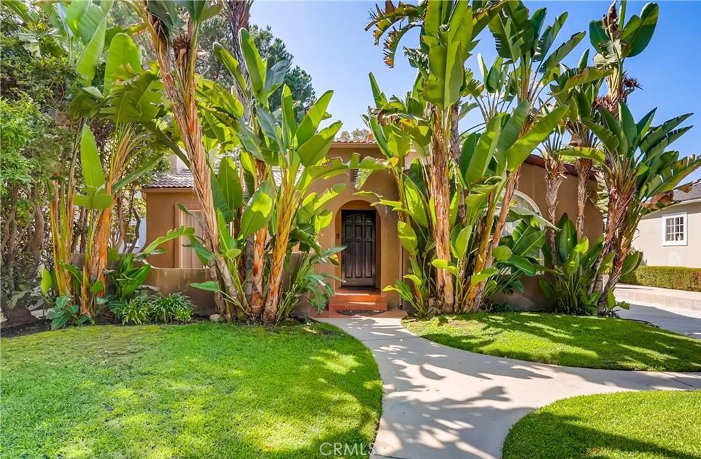 Spanish remodeled & updated 2 story home retains the classic character of yesteryear while having all the modern amenities of today. Walk past the front courtyard and enter a spacious living room with barrel vaulted ceilings, decorative fireplace, dark rich wood floors throughout & arched windows that flood the room with natural light. A large, open dining area features an arched window that looks out at the lush, landscaped front.The kitchen, a stunning functional space that's a Cooks dream, has quartz countertops, butcher block, stainless steel, 6 burner Viking stove & plenty of cabinet space all blended together beautifully! Adjacent is a large open Family/Media room great for gatherings that can flow to the backyard through French doors. There are 3 bedrooms with potential for a 4th off the Primary suite, a perfect space for a nursery/office. The large upstairs Primary suite has an abundance of natural light, walk-in closet & an en-suite bathroom with dual sinks, shower & separate soaking tub to relax in serenity surrounded by beautiful natural onyx. Downstairs are 2 large additional bedrooms w/walk in closets and a large bathroom. The backyard has plenty of grassy play/entertaining space & there's more...A detached, private studio/office/guest room with plenty of storage space. The home has plenty of on-site parking & is in close proximity to the Highly desirable Tujunga Village and all else in this coveted Studio City location offers. Come & take a closer look.