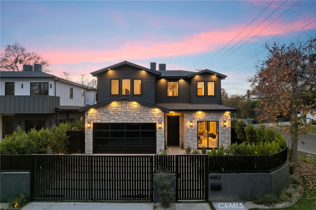 Situated on a gated corner lot in the heart of Studio City around the corner from Campbell Hall and Colfax Elementary, step inside to discover the pinnacle of modern day luxury living. Step inside this stunning brand-new construction to discover the pinnacle of modern day luxury living, where a meticulously designed open floor plan is adorned with impeccable finishes and thoughtful details throughout. An oversized sliding glass door spans the full width of the home, seamlessly extending the family room and kitchen into the backyard for true indoor-outdoor living. Equipped with top-of-the-line Thermador appliances, a massive waterfall island and walk-in pantry, the gourmet chef’s kitchen is a culinary enthusiast's dream. A butler’s pantry leads into the spacious formal dining and living room, the perfect space for hosting elegant dinner parties or intimate family gatherings. Upstairs, you'll find four generously sized ensuite bedrooms and a convenient laundry room. The chic primary suite consists of a private balcony, custom walk-in closet and sumptuous bathroom, complete with a soaking tub, large walk-in shower, double vanity and separate makeup vanity. Enclosed by privacy hedges, the entertainer’s backyard features a sparkling pool/spa, built-in BBQ, low maintenance artificial turf yard and ample patio space for al fresco dining and lounging. Additional highlights include a main-level powder bathroom, high ceilings, a smart home system with integrated speakers, state-of-the-art security system and two-car garage. The home offers 4 bedrooms and an office/den with its own entry. This property is ideally located within the top-rated Colfax School District and just moments away from Ventura Boulevard’s vibrant shopping and dining scene.
