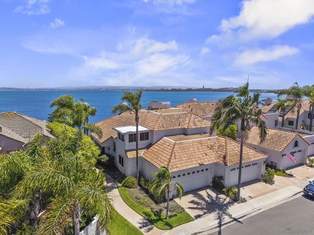 Spectacular waterfront townhome! Prime location on the bay, one of the very few homes right on the bay ... Right outside your door, enjoy unobstructed views of San Diego Bay and the city skyline. Waterfront access and incredible views. Jacuzzi on the second bedroom sun room. Extensive improvements throughout this end unit home. Seller has upgraded most every feature of this meticulously cared for home. There is a ring security system (Monitored). The Garage is finished and has a pull down attic that is floored. Main bedroom has an added sunroom overlooking the Bay. Seller has provided a detailed list of all upgrades and improvements available on request.