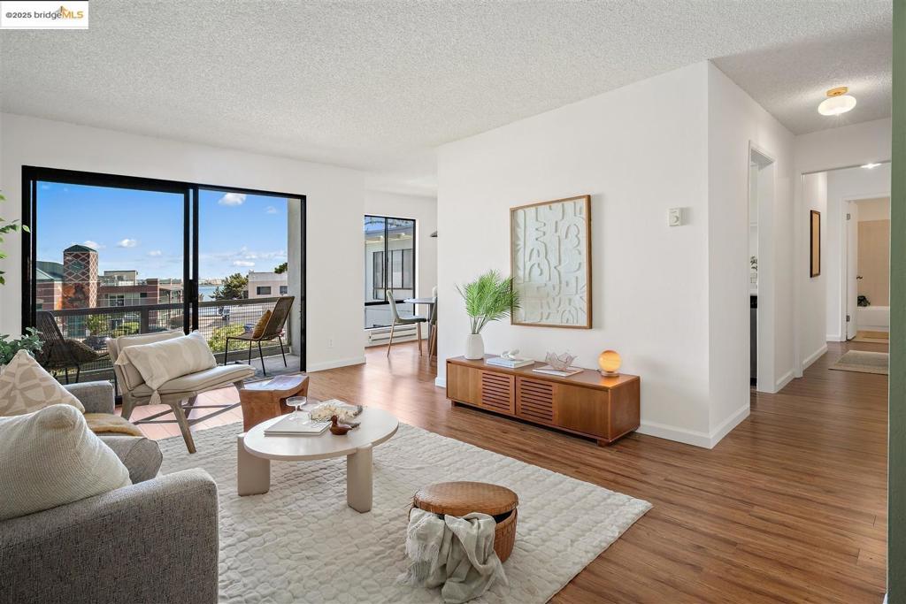 Stylishly Upgraded Waterfront Condo at Watergate! Bright, spacious, and move-in ready, this beautifully upgraded two-bedroom, two-bath condo offers modern comfort in a resort-style setting. Located on the third floor, the unit features a revamped kitchen with stone countertops, stainless steel appliances, updated hardware, and a sleek new faucet. Enjoy durable laminate flooring and elegant light fixtures throughout. The pool-facing master bedroom includes a large walk-in closet and an updated private bathroom featuring a stone vanity, modern backsplash, new mirrors, sink, and faucet—all designed to match the kitchen’s contemporary style. Start your mornings on the private balcony with views of the Bay and abundant natural light streaming in. Watergate’s premium amenities include four community pools, a full fitness center, spa, sauna, steam room, tennis courts, EV charging, 24-hour property patrol, and lush landscaped grounds. Convenient on-site laundry and covered parking add to the ease of daily living. Enjoy the perfect blend of style, convenience, and community—this is East Bay waterfront living at its best! OPEN HOUSE: SAT, JULY 12 & SUN, JULY 13 | 1-4PM
