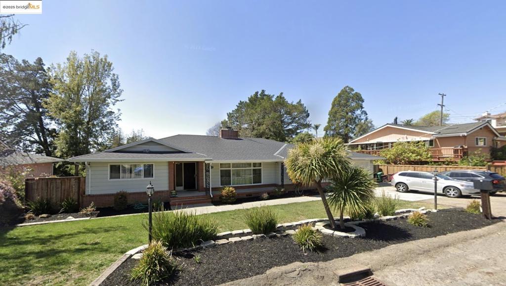 Come home to this hidden gem neighborhood of Chabot Park in Oakland! This well-maintained home boasts over 3,500 square feet of spacious living, including four bedrooms, three bathrooms, living and dining rooms PLUS a family room, two fireplaces, and a large eat-in kitchen. This ranch style mid-century house is seated on a large sloping lot, with sweeping views from the decks plus a large, flat yard down below. Just when you think you've seen it all, turn the corner and another room awaits. Two car side-by-side parking in the garage - this home has it all! Chabot Park is a serene, verdant, lush neighborhood with plenty of trees and gently sloping streets. Don't be surprised if you spot deer walking down the street. You'll feel far away from the hustle and bustle - the perfect retreat.