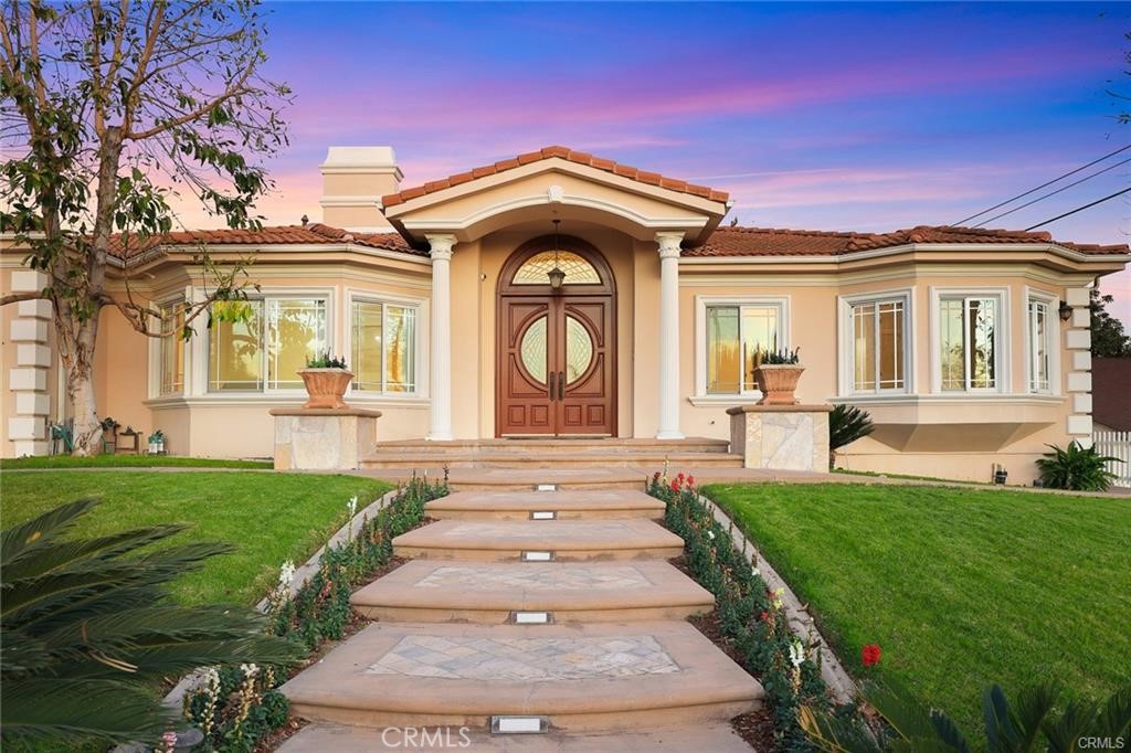 Welcome to the award-winning Arcadia School District home! This professionally designed, luxurious single-story residence with breathtaking mountain views features 4 bedrooms, 3.5 bathrooms designed with an open-concept layout and soaring ceilings. This home boasts high-end cherry wood cabinetry, premium appliances, marble flooring, and a living room with bay windows. The expansive family room is equipped with a Bose surround sound system, hardwood floors, and a custom-built bar. Elegant French double doors open to a stunning backyard featuring a Roman-style waterfall swimming pool. The primary bedroom includes a beautiful vanity, shower, and jacuzzi tub. A dedicated office space allows for multiple users simultaneously. This home also features both a Western open-style kitchen and a separate wok kitchen, a formal dining room with a built-in pantry, an independent laundry area with granite countertops and custom cabinetry, newly installed copper piping and electrical wiring, and two grand Swarovski chandeliers that enhance the luxurious ambiance.This is a perfect home for both relaxation and entertainment—don’t miss this incredible opportunity!