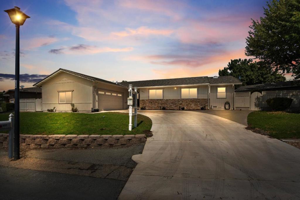 Looking for a great deal in Ridgemark? 471 Marks Drive has 3 bedrooms, 2 bathrooms, two living spaces, dining area, and a great yard. Cozy kitchen with breakfast bar that opens to a step down living space with wood burning fireplace. One level home. Additional amenities: AC unit, ceiling fans, indoor laundry room, Italian Porcelain tile flooring, owner bedroom walk in closet, and fresh paint. Attached two car garage with large driveway and guest parking. Relaxing backyard with porch, mature landscaping, fenced yard, shed, and beautiful sunshine. Move in ready. HOA covers private security in Ridgemark.