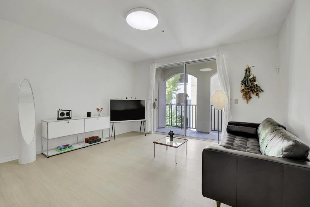 Welcome to this spacious 1-bedroom, 1-bath home featuring 831 sq. ft. of modern living. The open floor plan flows seamlessly from the updated kitchen into the dining area and living room, creating the perfect space for both everyday living and entertaining. The kitchen showcases quartz countertops, stainless steel appliances, and stylish cabinetry, while luxury vinyl flooring extends throughout the unit. The generously sized bedroom offers expansive closet space, and youll appreciate the convenience of in-unit washer and dryer. Additional features include dual-pane windows, central heating and A/C, and a private patio with extra storage. The Sonora offers resort-style amenities, including a sparkling pool, relaxing spa, fitness center, clubhouse, and beautifully landscaped grounds. Enjoy secure underground parking with your reserved space. Perfectly located near major highways, Light Rail, San Jose International Airport, and top Silicon Valley employers such as PayPal, Adobe, and Intel. HOA covers water, garbage, sewage, and access to all amenitiesoffering worry-free living in a prime location.