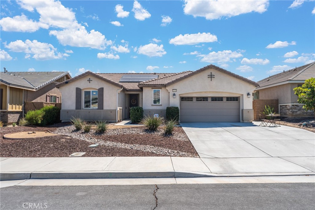 Welcome to easy living in sought-after Menifee Lakes! This 2018 single-story charmer greets you with a private courtyard entry, right across the street from the Lake allowing for a Lake view, and an airy, open floor plan anchored by a cozy fireplace. The chef-ready kitchen—complete with center island, granite counters, walk-in pantry, and adjoining dining area—keeps you connected to the action while you cook.
A spacious primary suite offers dual sinks, a soaking tub, separate shower, and an oversized walk-in closet. Two secondary bedrooms share a convenient Jack-and-Jill bath, while a separate powder room handles guests with ease. An indoor laundry room adds for everyday convenience.
Out back, unwind or entertain in an upgraded backyard —perfect for sunset grilling or morning coffee. As a Menifee Lakes resident, you’ll also enjoy access to the community pool, spa, clubhouse, fitness center, lake-side walking trails, basketball court, playgrounds, and picnic areas—all while being moments from shopping, dining, and the 215/15 freeways. Move-in ready, nicely upgraded, all on one level and solar is already installed—this is the Menifee home you’ve been waiting for. Schedule your private showing today and experience lake-community living at its best!