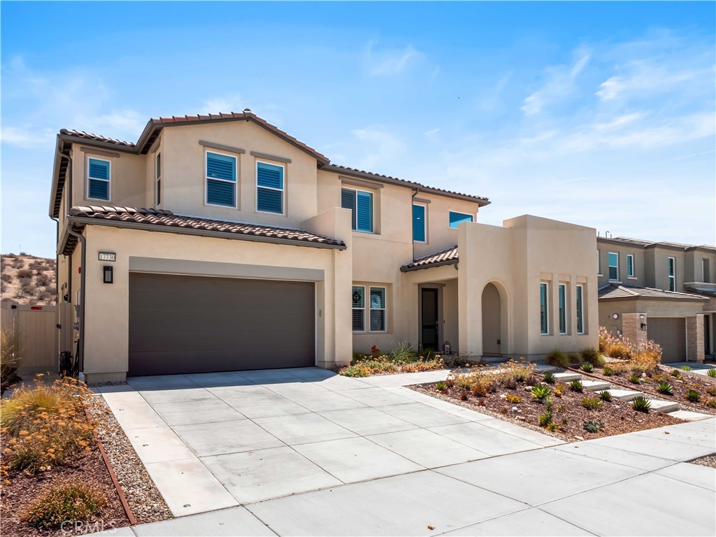 Stunning Brand-New 4 Bed, 4 Bath Skyline Home. This beautifully upgraded residence, located in the Starling neighborhood, features a downstairs ensuite bedroom, spacious bonus room, private office, airy loft, serene mountain and partial city views, owned solar panels, and an impressive list of high-end upgrades. The main level is designed for effortless entertaining, the open-concept layout centers on a chef's kitchen with a large central island, abundant cabinetry, and seamless flow into the dining and living areas. The living room showcases a sleek 72" linear fireplace with paint-grade mantel and slider opening to the covered patio. The bonus room is currently set up as a pool table room also connects to the yard. Additional features include a private office for work or study, a secondary powder room, mudroom, and a first-floor ensuite with upgraded tile. Head to the upper level and find a spacious loft which is perfect for a media or play area, while the laundry room offers a utility sink, storage cabinetry, and folding counter. All-optional cabinets throughout the home provide generous storage. The expansive primary suite boasts soaring ceilings, a private balcony with spectacular views, a walk-in closet, dual sinks, soaking tub, glass-enclosed shower, linen storage, and upgraded tile. Two additional bedrooms with raised-panel closet doors share a full bath with dual sinks. Interior Upgrades Include Smart TV pre-wiring in most rooms, whole-house sound insulation, upgraded flooring with premium padding and pet-friendly carpet, custom wood shutters and blinds, EV charging in the garage, and water softener plumbing. Outdoor Living with Low-maintenance, drought-tolerant landscaping front and back with decorative pavers, firepit, jacuzzi, covered patio, ample side yard space, widened driveway, Wi-Fi exterior lighting with holiday light package, and stunning views. The community includes kid's parks, dog parks, resort-style pools, clubhouse, bocce ball, recreation centers, and multiple trail entrances all minutes from restaurants, grocery stores, and more.