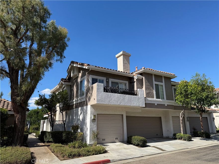 Beautiful condo nestled within the highly desirable Viewpointe gated community! This stunning upper-end unit offers upgraded living throughout with 2 spacious bedrooms, 2 full baths, and approximately 1,000 living space. Step inside to a bright, open living room with soaring ceilings, a cozy fireplace, and a private balcony—perfect for relaxing or entertaining. The gorgeous kitchen features granite countertops, stainless steel appliances, and ample cabinet space.  The primary suite includes a beautifully upgraded bath with dual sinks and a walk-in shower. Additional highlights include inside laundry, a one car attached garage, and an additional covered carport space.  This community offers resort-style amenities such as pools, spas, security patrol, and plenty of guest parking.  This condo truly has it all!