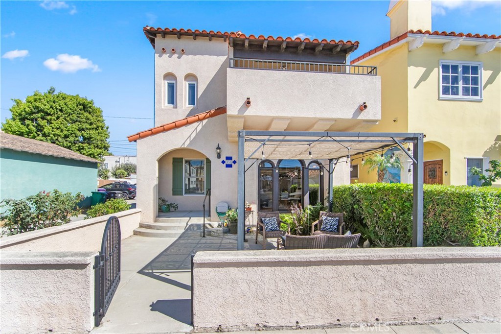 Welcome to your dream home in the coveted neighborhood of Belmont Shore—a beautifully re-imagined Spanish home that perfectly blends classic charm with modern upgrades. Step inside and be captivated by the warmth of this home, where original details meet contemporary comfort. The charming Dutch entrance door has a built-in screen to allow the nice breeze to come in while the gorgeous large arched picture windows flood the living spaces with abundant natural light. Downstairs offers the refinished hardwood floors, a living room with a gorgeous, cozy, remodeled gas fireplace with Spanish accent tile and a wall vent to the roof. A beautifully maintained original hall bath offers comfort and charm for guests. A generously sized kitchen that has been thoughtfully remodeled with an abundance of cabinets, stainless-steel refrigerator and stove and a nice big window that brings all the beautiful natural light and newer cement board floors in the kitchen and dining area. The elegant, remodeled stairs bring you up to the 2nd floor to a beautiful spacious master suite that offers a private retreat with built-ins, recessed lighting, four closets offering plenty of space for storage, brand new carpet and a spa-like bathroom with an oversized bath to soak in and relax, a separate shower, two vanities and storage cabinets for all your linens and a Samsung A/C split unit. Upstairs also offers a nice size bonus room that can be used as a guest bedroom or an office with access to a balcony where you can enjoy the breeze and relax as well as a convenient hallway bathroom for your guests. The attached two car garage offers steel storage racks, a newer motor for electric garage door and provides direct access to the kitchen area making it very convenient to bring your groceries in! Other great upgrades include interior painting, upgraded electrical panel and plumbing, central air and heat, resurface coating Spanish tile roof, newer water heater and custom drapes and blinds throughout all windows. Outside, a private patio provides a wonderful space to relax and enjoy the ocean breeze. Set up your umbrella and a comfortable seating area to soak up the sun. Located just a short walk or bike ride from Bayshore, dining, and boutique shopping, this home invites you to fully embrace the vibrant beach lifestyle Belmont Shore is known for, it is a wonderful place to call home. Come see it and fall in love with this beautiful beach home.