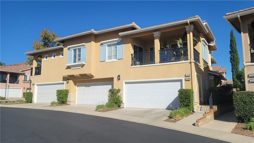 Desirable Valencia Cornerstone Town Home End Unit! No Mello Roos! 3 Bedroom + Loft, 3 Bath townhome with open floor plan!  Brand new carpet.   Tile Flooring begins at Entry and continues throughout the first floor.   Living Room has a cozy fireplace, and media niche.  Dining Room with recessed lights has sliding glass doors to the patio and backyard.  Kitchen with tile counters, cabinets with under cabinet lighting, gas cooktop, breakfast bar and walk-In pantry. Bedroom Two is located on the First Floor with a Full Guest Bathroom across the hall.  Inside Laundry Room with storage cabinets.  Upstairs Landing/Loft can be used so many ways.  Primary Bedroom Suite with large walk-in closet.  Primary Bathroom with dual sink vanity, walk-in shower, soaking tub and water closet.  Bedroom Three with Full en-suite bathroom.  Lushly landscaped backyard with wrap around patio.  Attached two car garage.  Newer A/C and FAU system.   HOA offers 2 swimming pools, spas, BBQs, picnic area, playground, and numerous guest parking options. Easy access to Santa Clarita paseo and trail system. Close to parks, shopping, restaurants and schools.  Contact your agent to schedule a showing before it's gone.