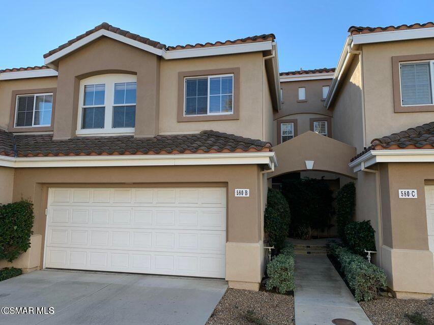 Immaculate & spacious Summer Side residence in Wood Ranch! Light and bright 3 bedrooms/2.5 baths. One bedroom is currently used as office with built in book shelves and desk. Decorative wall finishes, custom window coverings, upgraded base moldings, high ceilings, spacious living area with cozy fireplace, opens to the dining area adjacent to the kitchen and opens on to the lovely rear courtyard that backs to open hillside space. The master bedroom is spacious and the dual vanity master bath has a separate shower and soaking tub as well as large walk in closet.