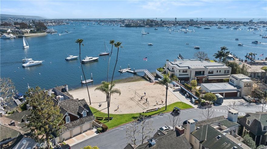 Welcome to your dream coastal haven at 2602 Circle Drive, nestled within the exclusive, guard-gated community of Bayshores in Newport Beach. This rare gem combines understated luxury with the simplicity of coastal living, providing seamless indoor and outdoor spaces. Enjoy the bay breeze in this picturesque neighborhood, which features private beaches, volleyball courts, and a private dock. Step inside this meticulously crafted 4-bedroom, 2.5-bath home and experience the seamless integration of functionality with an open-concept living room perfect for entertaining and intimate gatherings, featuring high ceilings, inviting natural light, and a cozy fireplace, creating a relaxed atmosphere. Enjoy the additional spacious family room with high ceilings, offering a separate area for entertaining. Seamless transition to the gourmet kitchen - an equal balance of form and function, a culinary delight, showcasing quartz countertops, a farmhouse sink, and top-tier appliances, including a dual Sub-Zero refrigerator, a Wolf six-burner range with grill, custom cabinetry, and a generous center island that elevates the space. Seamlessly blending indoor and outdoor living, the doors open to a lovely private patio with a built-in BBQ, creating the quintessential indoor/outdoor experience for alfresco dining. The home underwent a comprehensive transformation in 2019, thoughtfully reimagined with every detail meticulously considered, resulting in a visually stunning and exceptionally livable residence, complete with thoughtful built-ins throughout. The main-floor primary suite is a tranquil retreat featuring a spa-inspired bathroom equipped with towel warmers, a large walk-in shower, and dual sinks. Step into the expansive custom walk-in closet with a center island, custom built-ins, and luxurious lighting. Upstairs, the three bedrooms provide ample space; one is currently used as a dedicated office, offering a private retreat featuring a large deck. Additional amenities include an attached two-car garage with epoxy flooring, a separate laundry room with ample storage, a Sonos sound system, and parking for a golf cart. Experience the unparalleled Bayshores lifestyle—a perfect blend of refined coastal design and modern functionality. Don't miss the opportunity to own a home where every detail has been thoughtfully reimagined for an exceptional living experience. Seize this rare chance to own a meticulously upgraded home in one of Newport Beach’s most coveted communities.