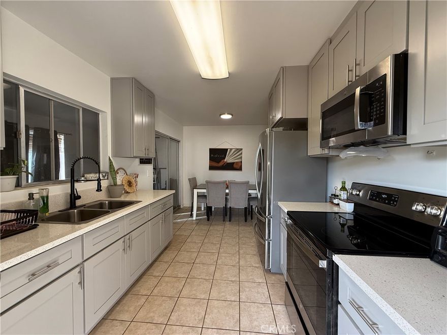 Charming 2-bedroom, 1 bath home centrally located in Yucca Valley.  Conveniently close to shopping, restaurants, and stores, this cozy updated home is perfect for first time home buyers or as an investment property.  The remodeled kitchen features quartz countertops, stainless steel appliances and modern finishes.  Tile floors throughout for easy maintenance.  Enjoy the bonus room-ideal for an office, studio or extra living space.  The backyard offers a peaceful retreat with a fire pit area. garden space and a storage shed.  Relax on the covered patios in both front and back.  Perfect for morning coffee or evening al fresco dining.  Call today to schedule your private showing.