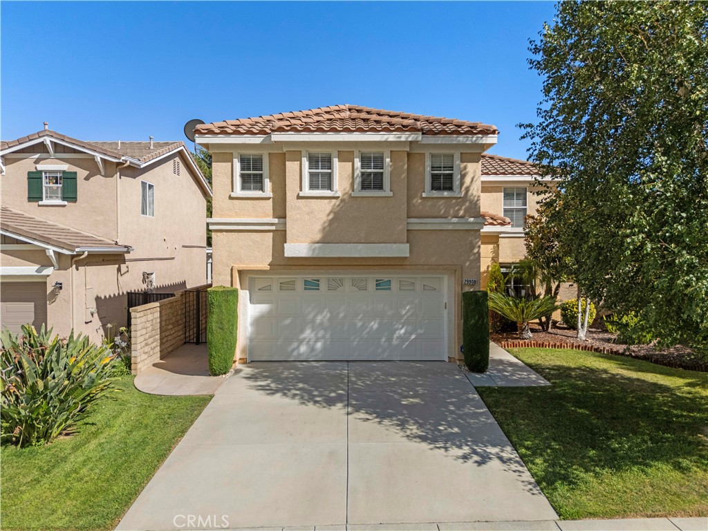 Home Is Where the Heart Is with this Castaic Charmer with Space, Style, and Comfort. Nestled in a friendly neighborhood with picturesque curb appeal, this beautifully updated 4-bedroom, 2 1/2-bathroom home offers the perfect blend of modern upgrades and inviting warmth. From the moment you arrive, the manicured lawn, mature tree, and welcoming entry set the tone for what’s inside. Step through the front door into a bright, open-concept living space where rich wood floors flow seamlessly from the dining area into the cozy family room, complete with a charming fireplace, perfect for relaxing evenings. The light-filled kitchen boasts extra-tall cabinets, sleek stainless steel appliances, and generous counter space, making it a dream for both everyday living and entertaining. Upstairs, the thoughtfully designed layout includes all bedrooms, 2 bathrooms and a huge bonus room. The spacious primary suite features a large walk-in closet and spa-like bathroom with dual sinks and modern finishes. Two additional bedrooms offer flexibility for family, guests, or a home office, while the extra-large bonus room is perfect for an extra bedroom, media space, playroom, or creative studio. Step outside to your private backyard retreat—ideal for weekend BBQs, gardening, or simply enjoying the California sunshine. A 2-car garage provides plenty of storage and parking, and the home’s location offers easy access to parks, shopping, dining, and the 5 freeway. Beautifully maintained and move-in ready, this Castaic gem is the perfect place to create your next chapter.