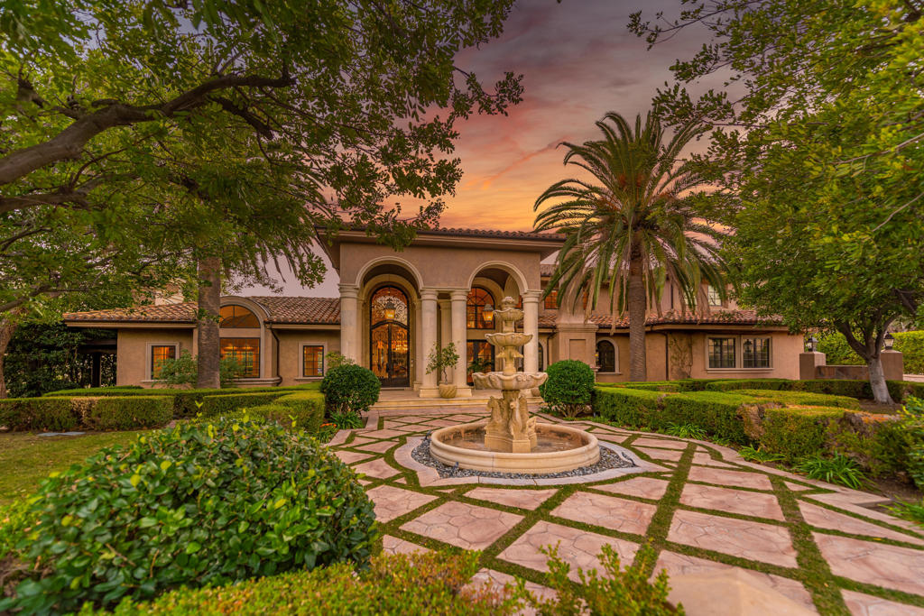 Set on a tranquil 1.5-acre cul-de-sac lot, this Italian Villa in Westlake Village stands as one of the most sought-after estates in the area. Designed for those who appreciate luxury living and entertaining, this European-inspired residence offers incredible mountain views and ultimate privacy, all within the exclusive Country Club Estates community. With approximately 11,000 square feet of living space, the home seamlessly blends classic elegance with modern comforts.The grand formal living room welcomes you with soaring ceilings and ample natural light, while a cozy library offers a quiet retreat. The expansive gourmet kitchen, ideally located next to the family room, is a chef's dream. It features a distressed wood-beamed coffered ceiling, custom copper accents, a full wet bar, and a wine cellar. A striking fireplace anchors the space, making it perfect for both casual family gatherings and formal entertaining. Adjacent to the kitchen, the formal dining room opens to a covered loggia, where you can enjoy a heated outdoor dining patio and a comfortable lounge area for year-round entertaining.On the main level, you'll find a private apartment suite that offers a separate living space, kitchen, and bedroom, all with direct access to the backyard. It's the ideal set-up for guests or multi-generational living, providing both comfort and privacy.Up the grand staircase, the master retreat awaits--spacious and serene, with a beautiful marble fireplace as its centerpiece. Two generous walk-in closets provide ample storage, and the luxurious en-suite bathrooms offer a spa-like experience, complete with a soaking tub and separate sauna. This level also features four additional well-sized secondary bedrooms, each with its own en-suite bathroom, ensuring plenty of space for family and guests.Designed with Southern California's indoor/outdoor lifestyle in mind, the estate's expansive grounds include a separate casita/pool house, complete with a fireplace, kitchenette, and full bath--perfect for poolside gatherings or as a guest retreat. Lush, manicured lawns surround the property, along with formal gardens that add beauty and privacy. The centerpiece of the backyard is a sparkling pool and spa, all set against a backdrop of breathtaking mountain views.This estate truly offers the best of California living, where every detail has been thoughtfully designed to provide both luxury and comfort. Whether enjoying intimate family time indoors or hosting large gatherings outdoors, this home offers the perfect setting for every occasion.
