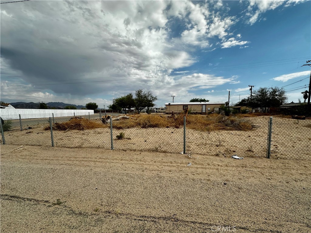 Corner Lot with Chain-Link Fencing – Ready for Your Vision!
Don't miss this excellent opportunity to own a fully fenced corner lot perfect for a residential home, mobile home, or manufactured home. This spacious parcel offers flexibility and easy access, making it ideal for your next home site.. The property is enclosed with a durable chain-link fence for added security and peace of mind. Whether you're looking to build or bring in a manufactured home, this lot provides the space and location to make it happen. Utilities nearby. Drive by and imagine the possibilities!