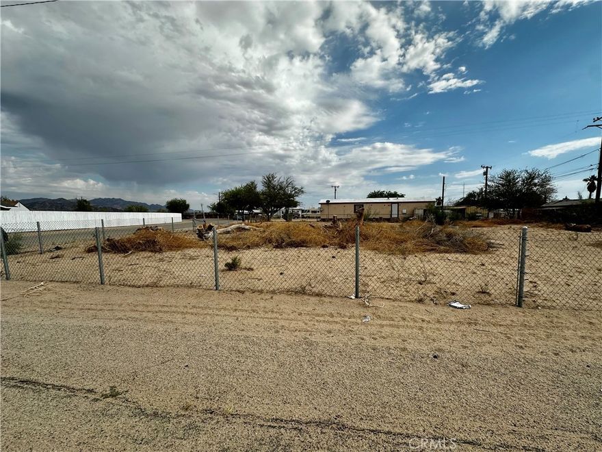 Corner Lot with Chain-Link Fencing – Ready for Your Vision!

Don't miss this excellent opportunity to own a fully fenced corner lot perfect for a residential home, mobile home, or manufactured home. This spacious parcel offers flexibility and easy access, making it ideal for your next home site.. The property is enclosed with a durable chain-link fence for added security and peace of mind. Whether you're looking to build or bring in a manufactured home, this lot provides the space and location to make it happen. Utilities nearby. Drive by and imagine the possibilities!