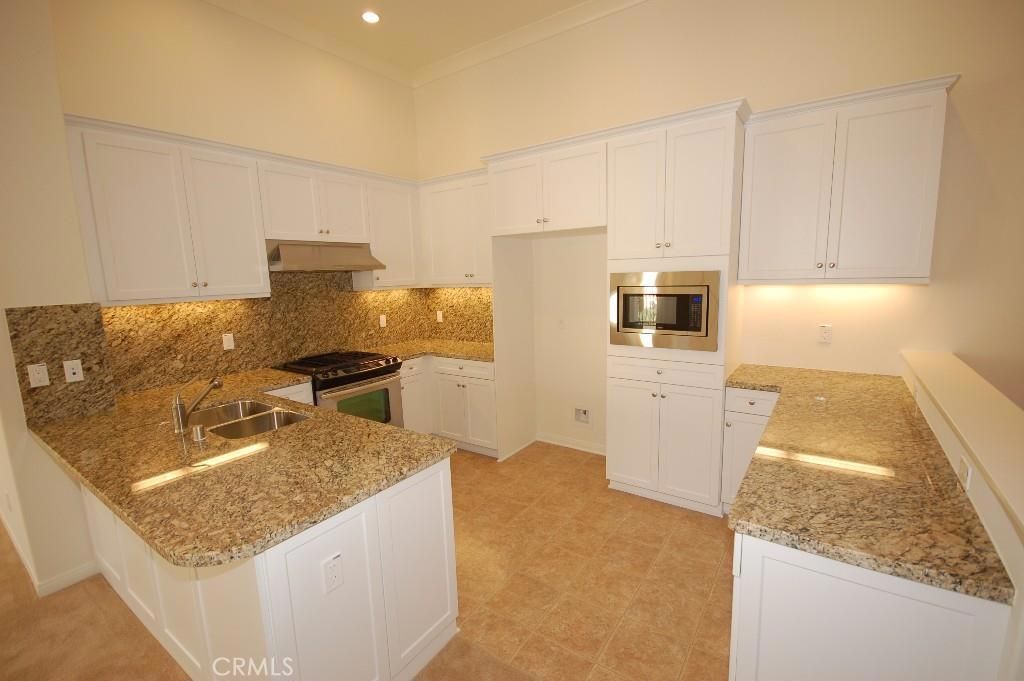 Photo of 136 Overbrook, Irvine, CA 92620 (MLS # OC26035165)