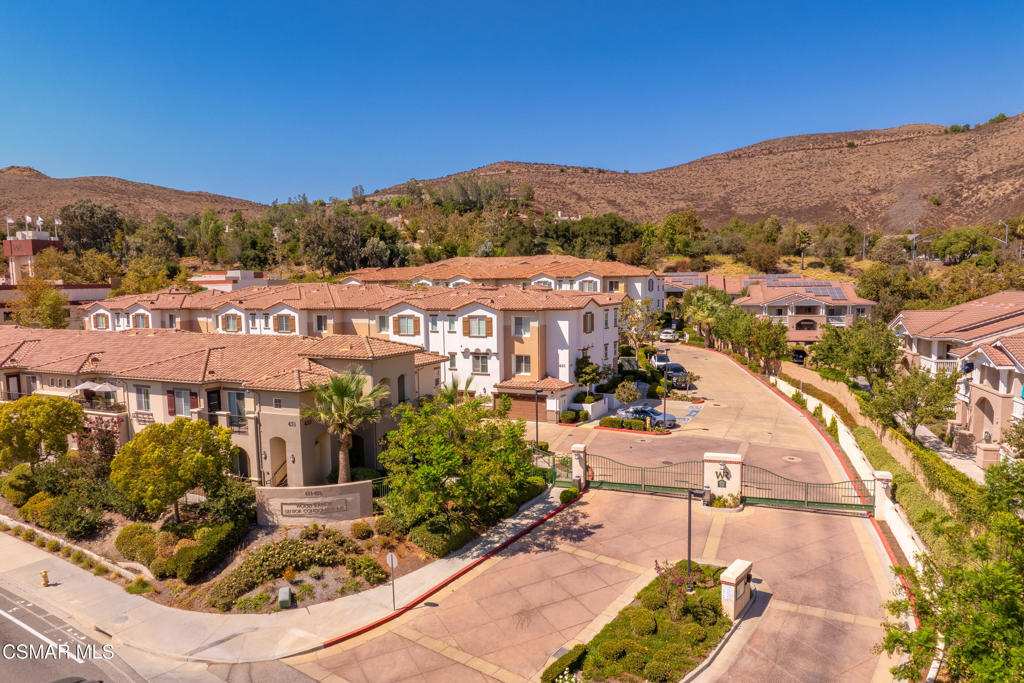Welcome to this remodeled upper level 2 bedroom 2 bath condo in this peaceful Woodranch gated 55+ community. This light filled unit features an open floor plan with modern upgrades through out, including wood style flooring,, recessed lighting, and newer carpeting. The updated kitchen offers Granite counter tops, stainless steel appliances, and custom cabinetry..Tall ceilings make this place so open and airy. Beautiful morning views from the living room, dining area, and cute patio area. The generously sized bedroom offer great closet space and natural light. Both bathrooms nicely upgraded and designed stylish fro comfort and safety. There is a laundry area right outside the bedrooms for easy access. Downstairs is single car garage with storage, and an elevator directly from your garage make it accessible to get right to your front door. Community amenities include pool & BBQ area, Steps to dining and shopping!.