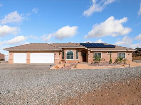 Photo of 7925 Anaconda Ave, Oak Hills, CA 92344 (MLS # HD25232907)