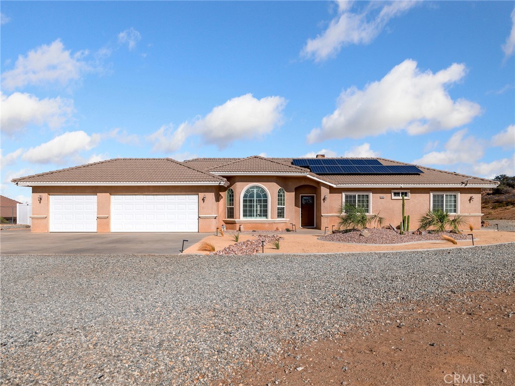 Welcome to Your New Home!
Enter through the solar-powered entry gate and discover this well-maintained, tastefully updated, and move-in ready home. Situated on an elevated 2+ acre lot, you'll enjoy panoramic views of snow-capped mountains and the desert valley below—a peaceful retreat that perfectly balances comfort and efficiency.
Curb Appeal & Outdoor Features
New desert landscaping in both front and back yards
Freshly painted trim and eaves for a clean, updated look
New front door adds charm and security
5-camera security system for added peace of mind
Backyard is fully fenced with upgraded vinyl fencing, with 3 gated access points
Energy-Efficient & Smart Upgrades
Owned solar system – enjoy the savings with no lease
Smart thermostat for efficient climate control
Smart bathroom fan with Bluetooth and customizable light settings
Energy-efficient lighting throughout the home
Interior Highlights
Welcoming family room with a cozy wood-burning stove
Open-concept kitchen with a breakfast bar and plenty of cabinetry
– Stove and dishwasher replaced in 2019
Spacious primary suite featuring:
Lockable walk-in closet with motion-sensor lighting
Upgraded can lighting with mood settings (also in living room)
Three full bathrooms include:
Newer tall toilets in all bathrooms
Updated fixtures in hall and guest baths
One bedroom includes child-safety electrical outlets
Garage & Storage
Finished garage with sleek, durable epoxy flooring—perfect for a workshop, gym, or clean storage space
Conveniently located moments from the I15 freeway perfect for commuters. Lots of privacy, but close enough to all amenities.