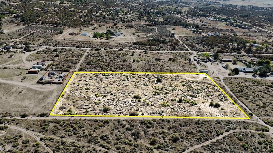 Beautiful 4.91 acre mostly flat and usable lot. The lot has 360 degree views of Mountains and valley and sits in a wonderful location in town with privacy yet not far from town or pavement. There is a small graded area to give you an idea of what your home site could look like. Perfect lot for anyone who wants the flexibility of a usable lot. This is one of four adjacent lots for sale ask your agent for a lot map and take your pick! The lot recently had all corners marked by a surveyor. Use caution when driving onto newly graded pad as soil is loose.
