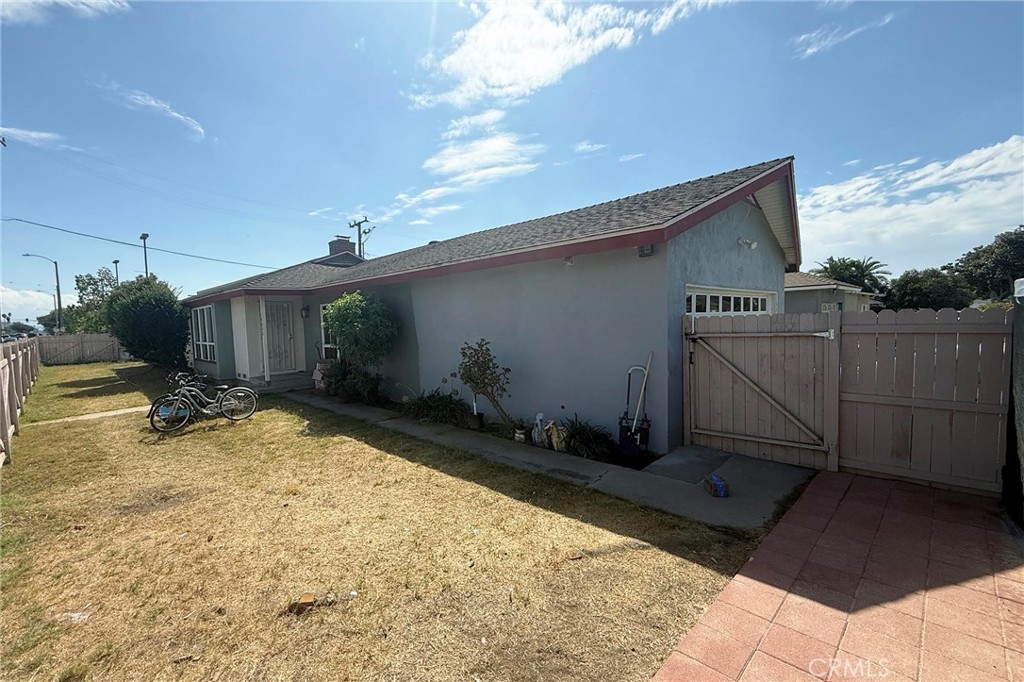 This single level home has 3 bedrooms, 2 baths (1 + 3/4), fireplace plus a BONUS room, 1579 SF of living space and 8125 SF lot. This home has newer 200 amp electric panel, HVAC and remodeled kitchen. Bonus room (between the main house and garage) has been converted to a studio with its own private entry (French door), kitchen, 3/4 bath and washer/dryer hookup. Attached garage recently converted to house a 1 bedroom unit with its own private entry, kitchen 3/4 bath and washer/dryer hookup. Close to Disneyland, shopping centers, restaurants, schools and freeways.