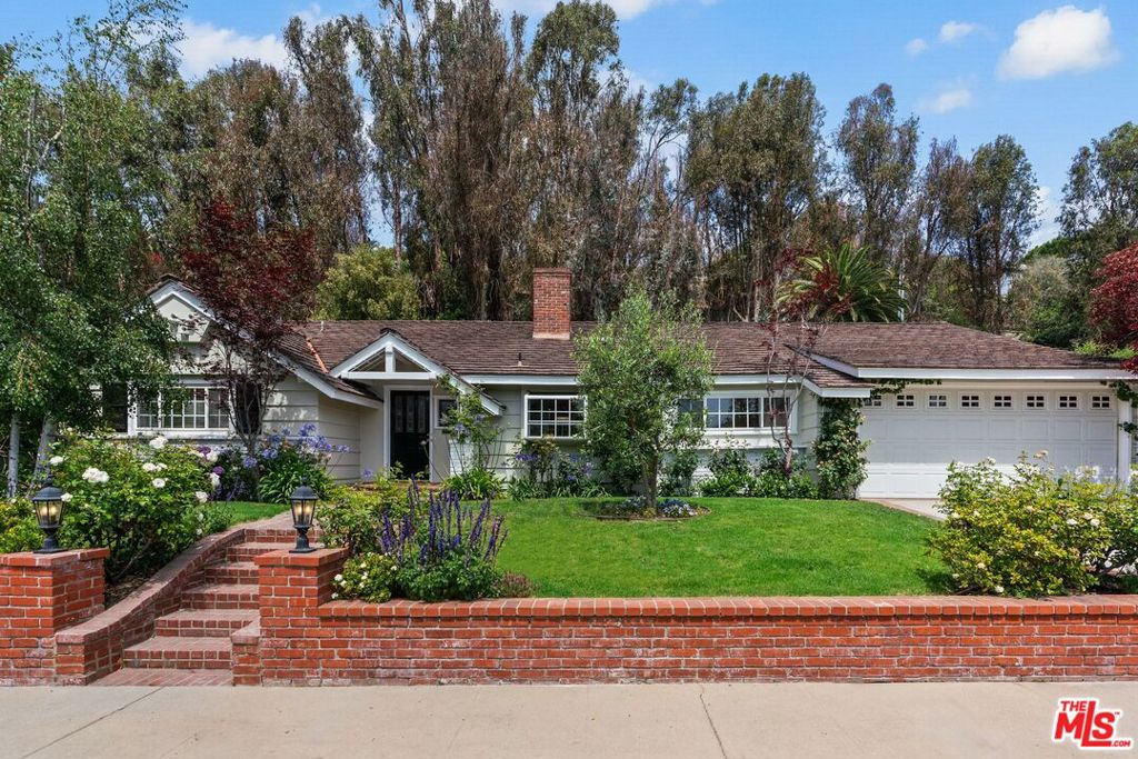 Nestled in the heart of Brentwood's sought-after Polo Fields neighborhood, this single-level ranch home exudes charm and privacy. Featuring hardwood floors, granite countertops, and an open-concept living and dining area, this home is perfect for both relaxed living and entertaining. The den area with a wet bar and french doors leading to a patio invites seamless indoor-outdoor living. Freshly painted and filled with natural light, the dedicated primary bedroom wing offers a walk-in closet and peaceful views of the lush, mature landscaping. Set on a spacious lot with a beautifully manicured front yard, this home provides a tranquil retreat with unparalleled convenience. Located just moments from the Riviera Country Club, Santa Monica, and the iconic Brentwood Country Mart, and mere minutes from top-rated schools, this is truly a Brentwood gem.