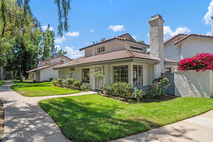 Nestled in a serene setting overlooking rolling hills, oak trees, and a seasonal creek, this exquisitely remodeled townhome blends sophistication with comfort. Every detail has been carefully curated, from the wide-plank luxury vinyl flooring to the custom finishes that make this home truly one-of-a-kind. Sharing no common living space walls, this standalone towhome has the feel of a single-family residence without the maintenance. Step inside to soaring ceilings, abundant natural light, large windows that frame the picturesque views, and a striking fireplace that sets the tone for the beauty you'll discover throughout every space in this home. The chef's kitchen is a showpiece, with quartz counters featuring a waterfall edge, herringbone stone backsplash, soft-close cabinetry, new appliances, and expansive windows that capture sunshine. Two spacious bedrooms on the first floor offer flexibility for a home office, nursery, den, or main floor Primary Suite with one enjoying direct access to a beautifully designed bathroom. Upstairs, the private primary suite includes vaulted ceilings, an office / study nook, walk-in closet, and a bright and airy bathroom finished with stunning designer finishes making every moment in this space feel special. Two patios create an ideal environment for gardening, dining al fresco, entertaining, or simply listening to the tranquil breeze. An oversized two-car garage adds convenience and storage, while the community pool + spa and meandering greenbelts invite relaxation. All within minutes of Oak Park's award-winning schools, parks, hiking trails, and Malibu beaches.