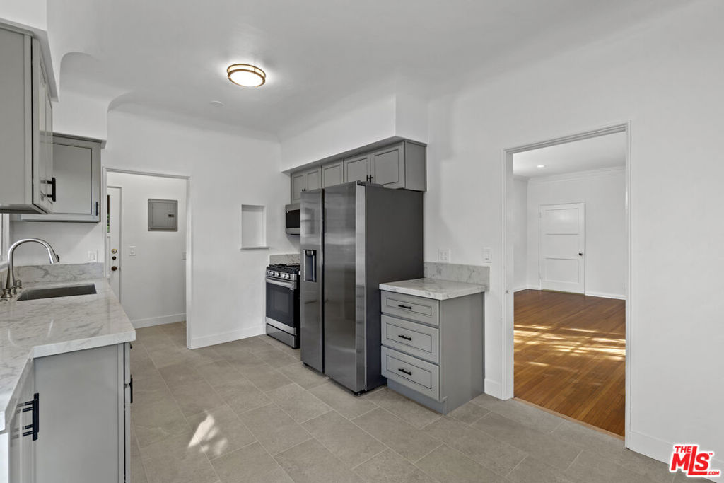 Welcome to this thoughtfully updated, oversized one bedroom charmer in Century City. The unit features a large living space with original hardwood floors and period details that include a mantel and crown molding all illuminated by new recessed lighting throughout. The new designer kitchen is of a standard rarely seen in rental apartments; High quality cabinets, Quartz Countertops and a new set of stainless steel appliances complete this gorgeous space framed by the original rounded ceilings that showcase classic 1930's architecture. Just through the kitchen is a laundry area with new stacked washer & dryer as well as additional storage. Unit includes one garage parking spot & one street permit parking. The property sits just one block away from Rancho Park, moments to Westfield Century City, easy access to the 405 freeway, minutes to Beverly Hills and a short drive to the beach.