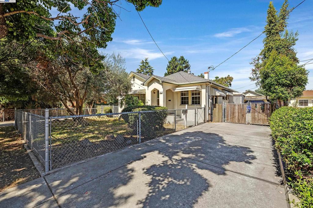 Vintage Charm Meets Opportunity- This 2-bedroom, 1-bath home is brimming with character—from its classic fireplace to the dedicated dining room that’s perfect for cozy gatherings. Inside laundry adds convenience, while the layout offers a solid foundation for your vision. Yes, it needs work—but with the right touch, this could be a timeless gem. This home is ready for the next chapter! Exceptional opportunity-fixer with great potential. As-Is sale. Generous size lot with double-side access and 2 gated driveways. Endless possibilities to expand existing home or add a guest house (check with city) renovate, resell or hold as a long-term investment. This property presents a rare chance to maximize your return. Close to shopping, public transportation and restaurants. Brand new electrical panel. Please note: certain areas of the home, yard and out-buildings are in need of repair and may present hazards. For safety reasons, children must not be left to roam the property unsupervised.